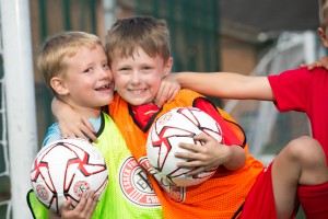 Two young players hugging - summer camp 2016        